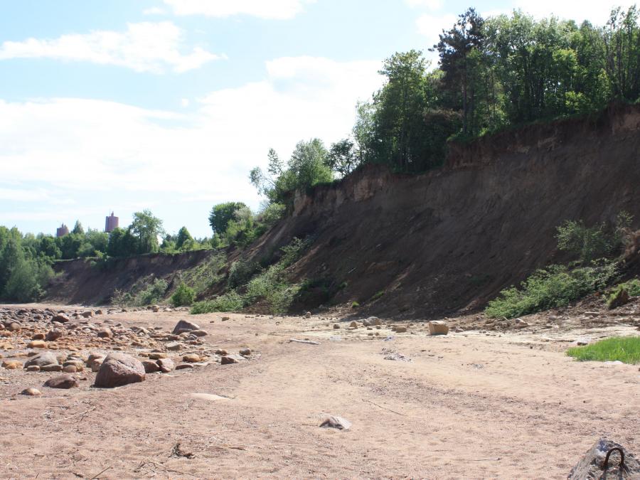 Elongated and comparatively steep (sometimes vertical) slope separating flat or gently sloping areas. See also Cliff.