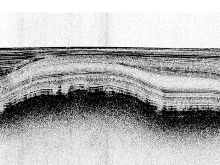 Crater in the seabed, usually one to tens of meters but as large as a few hundred meters in diameter, formed by the expulsion of gas and/or fluid from sediments.